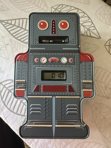 Tin robot counting money - tin,